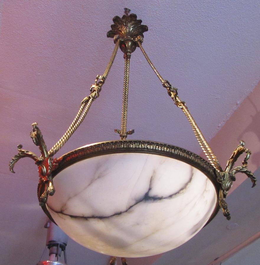 An Alabaster and bronze ceiling light