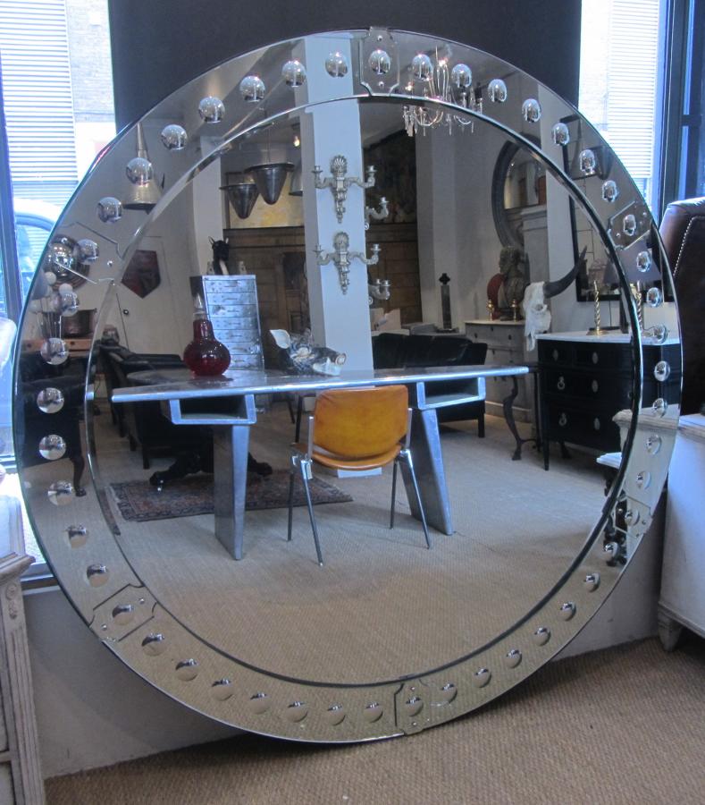 A large round punted mirror