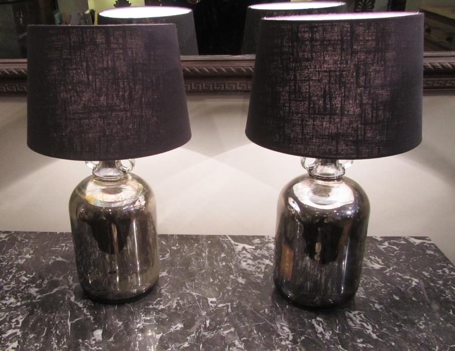 A pair of silvered lamps
