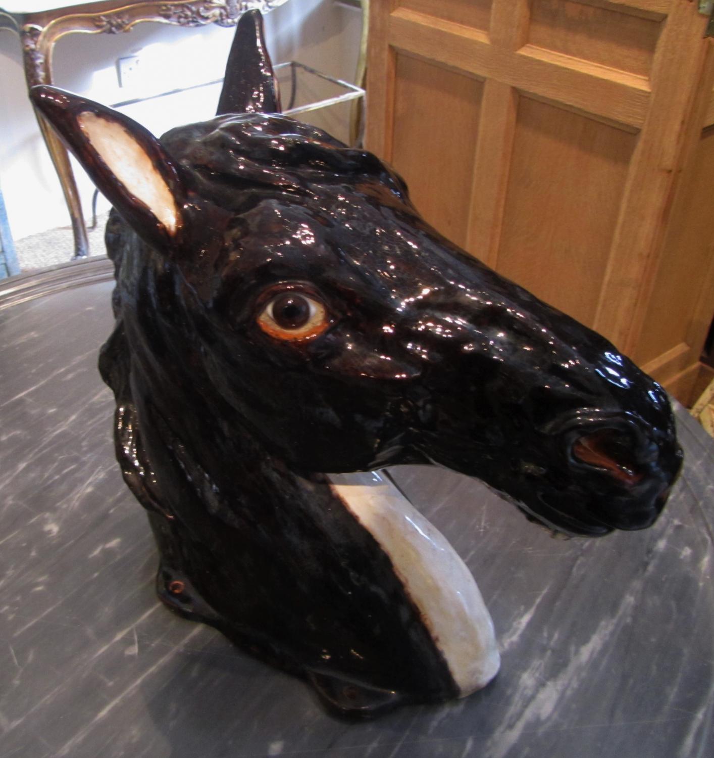 A glazed terracotta horses head