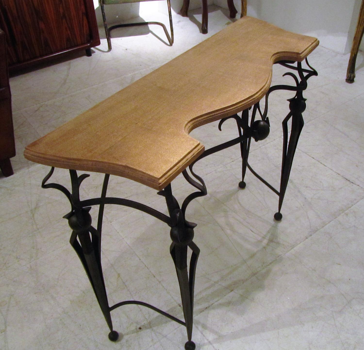 A pair of wrought iron consoles