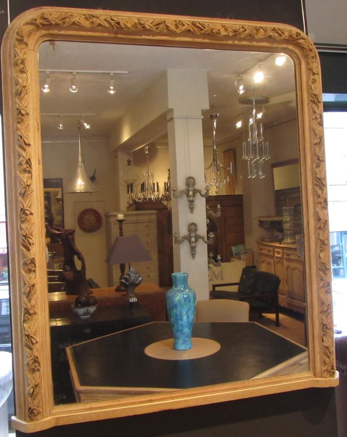 A carved Oak overmantel mirror