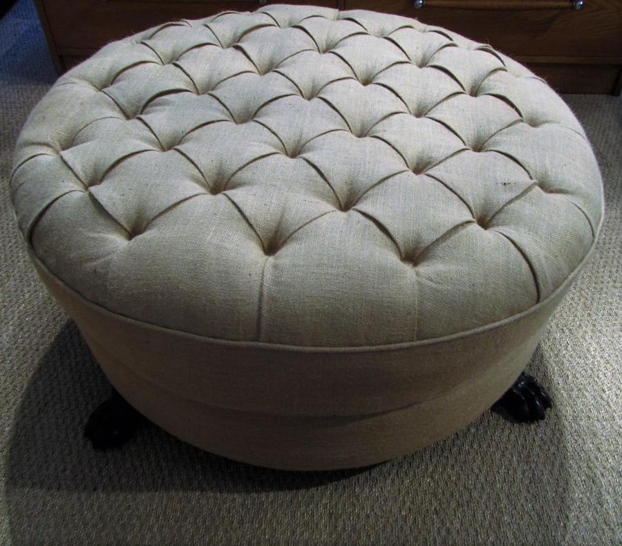 A large round foot stool ottoman