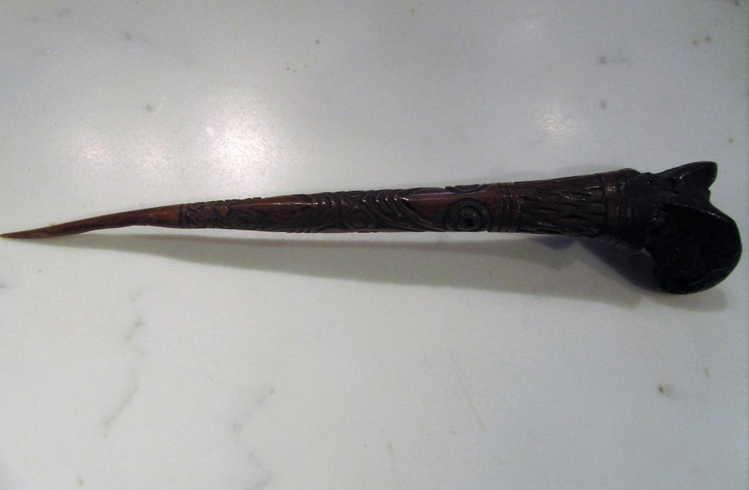 A tribal carved bone dagger