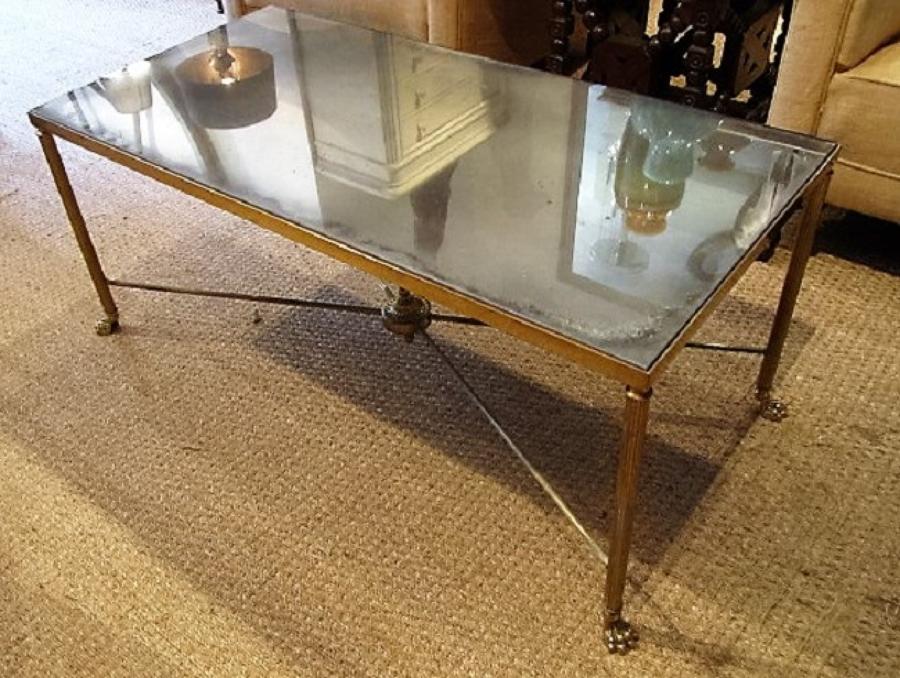 A brass and mirror coffee table