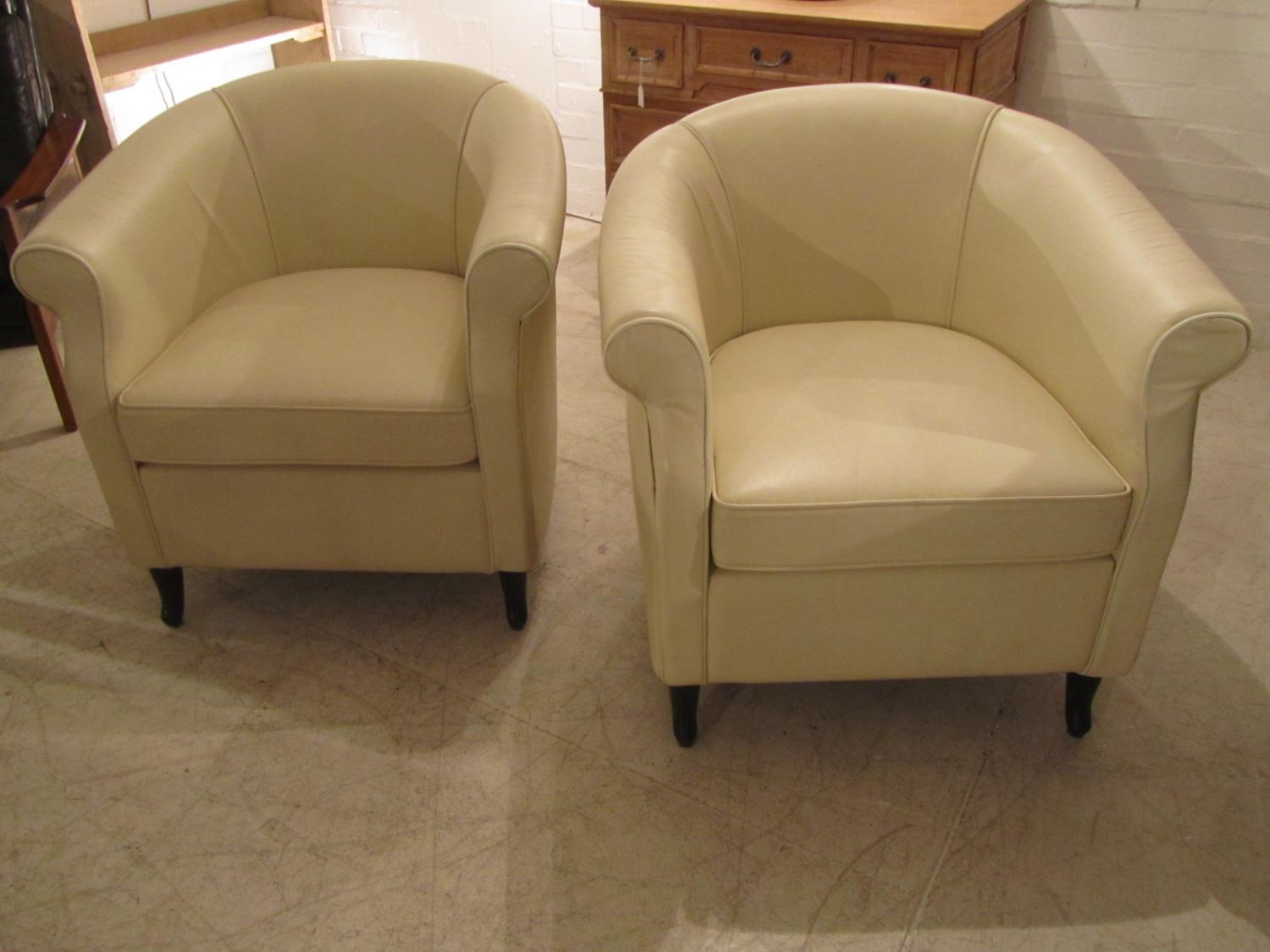 A pair of deco leather armchairs