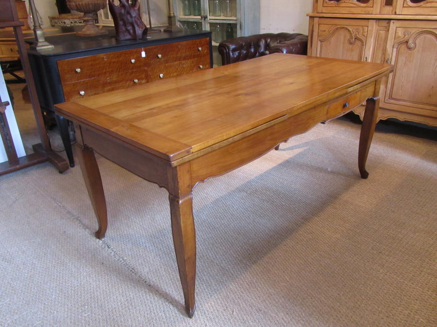 A cherry wood farmhouse table