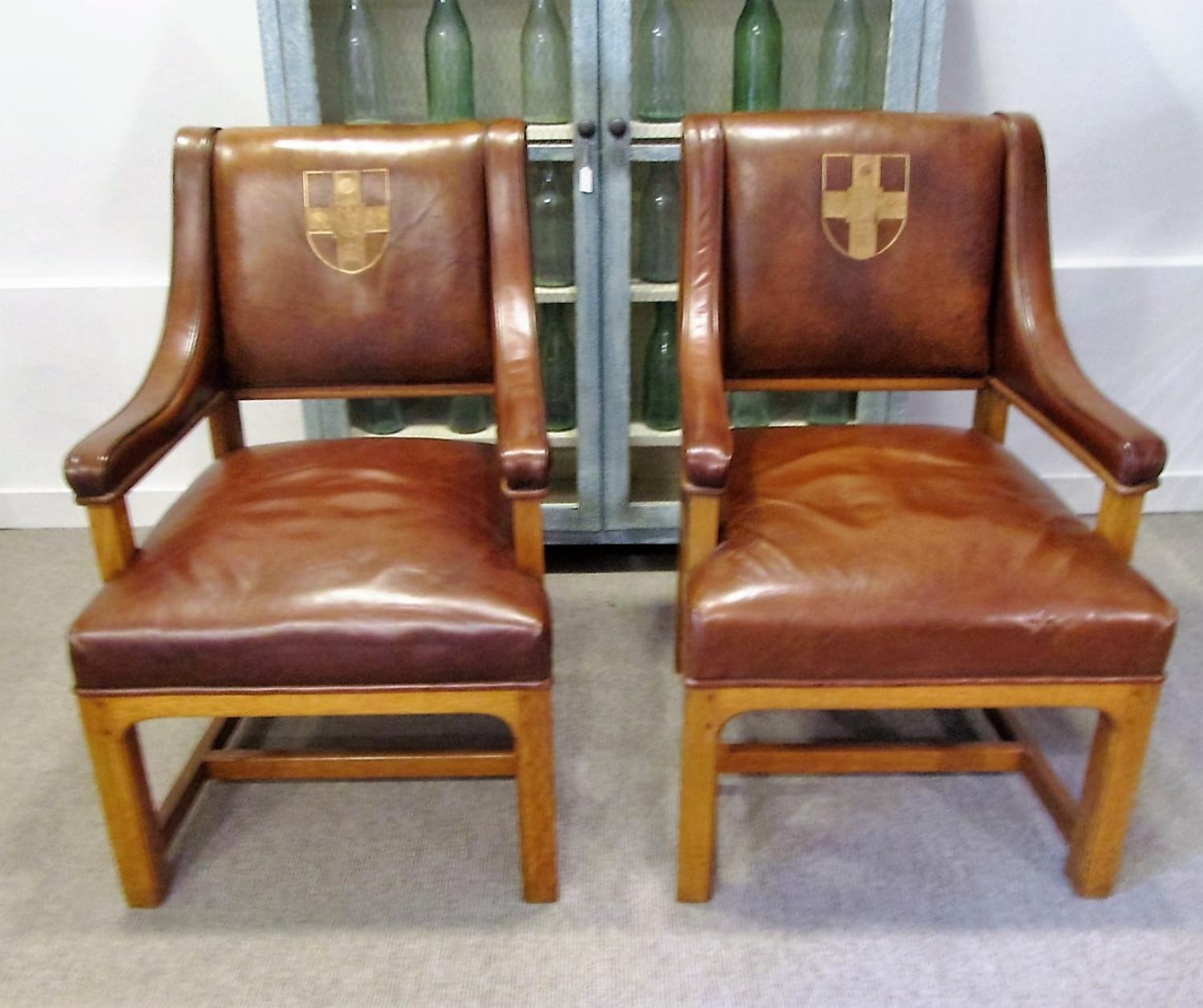 A pair of leather dean's chairs