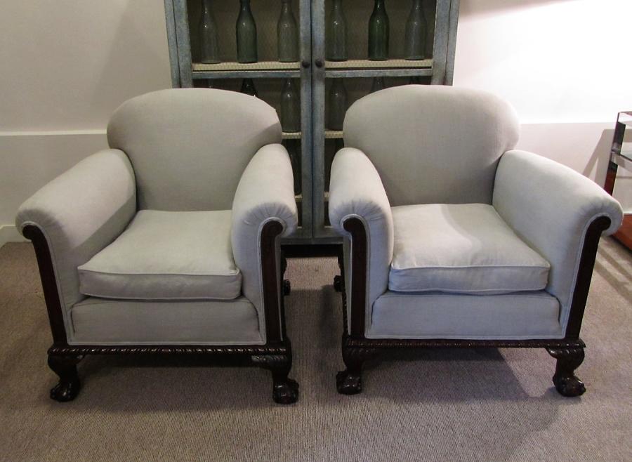 A pair of English country house armchairs
