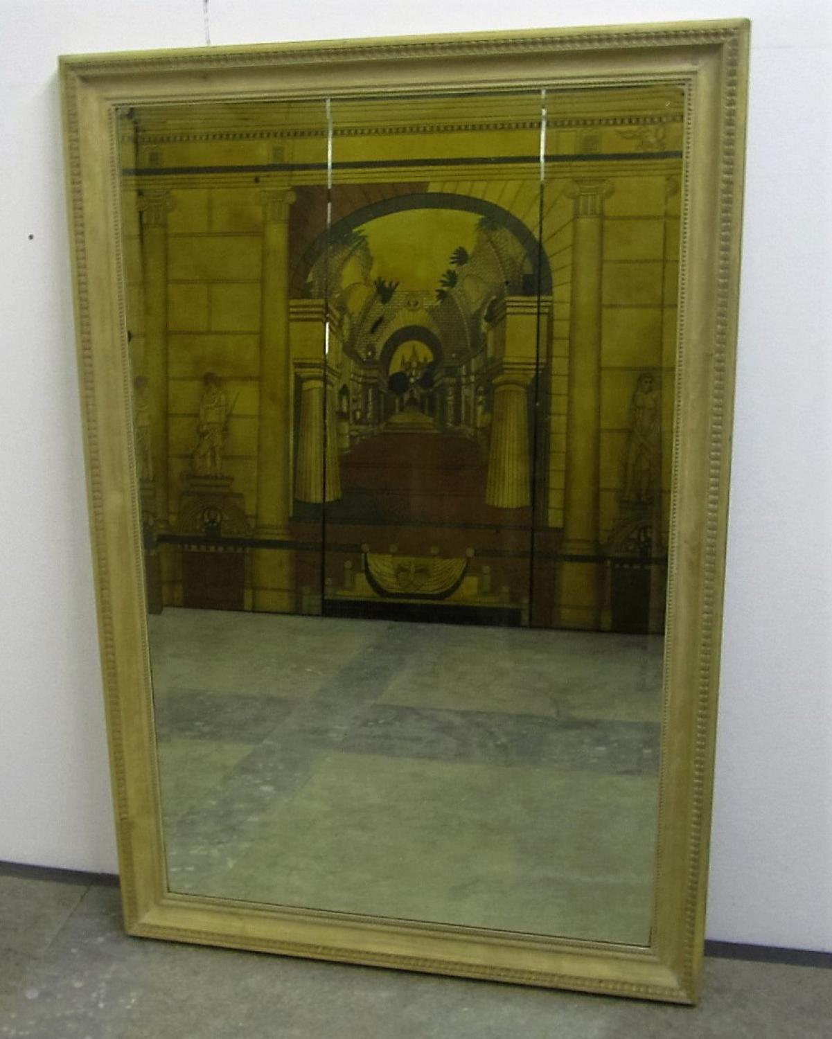 A bleached carved walnut mirror