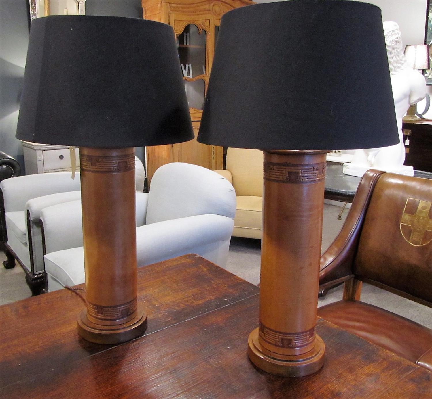 A pair of leather and Mahogany lamps