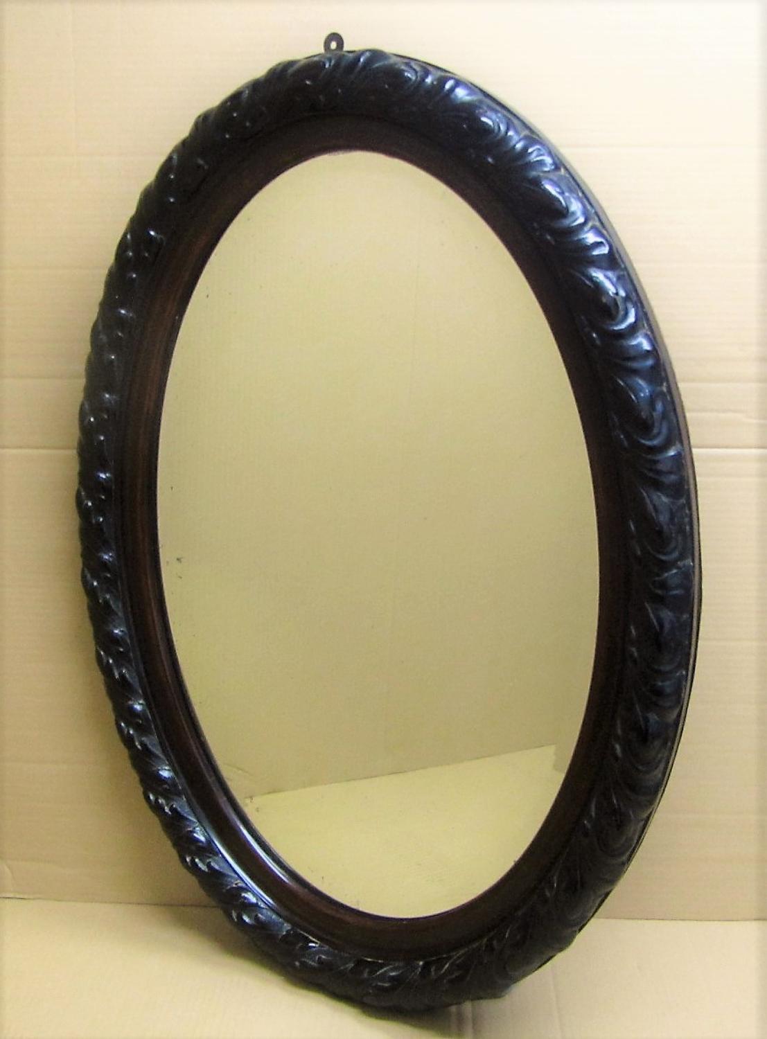 An oval bevelled mirror
