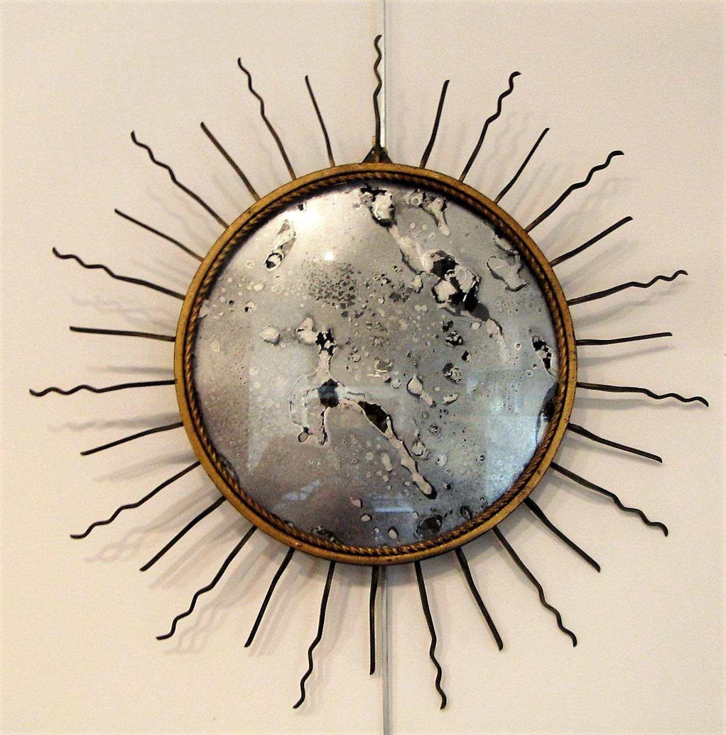 A gilt metal sunburst mirror