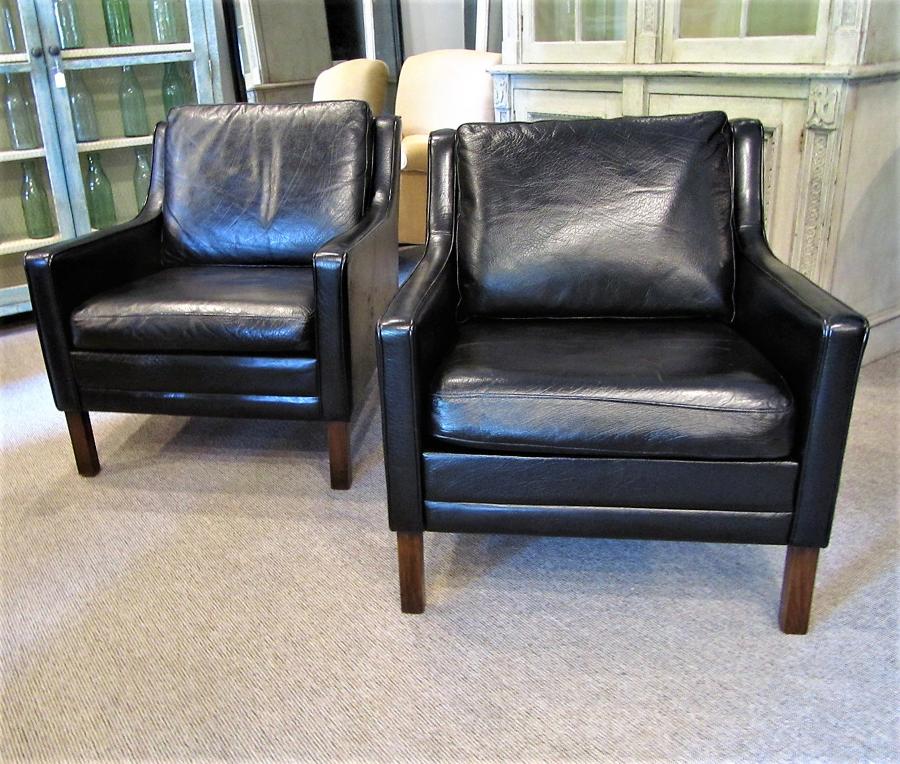 A pair of leather armchairs