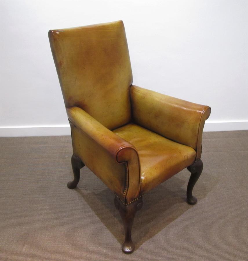 A Georgian pad foot arm chair in leather