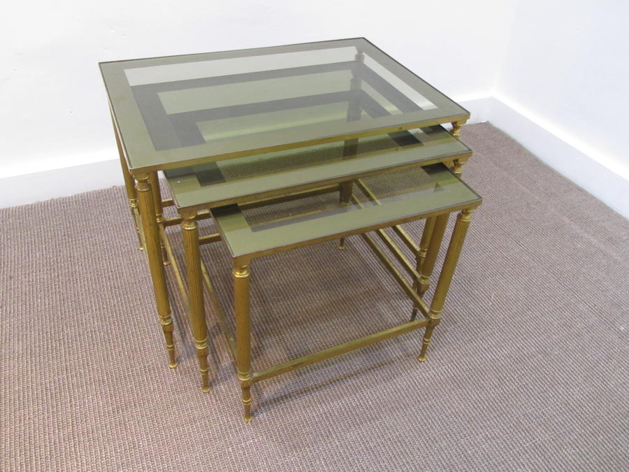A set of brass nesting tables