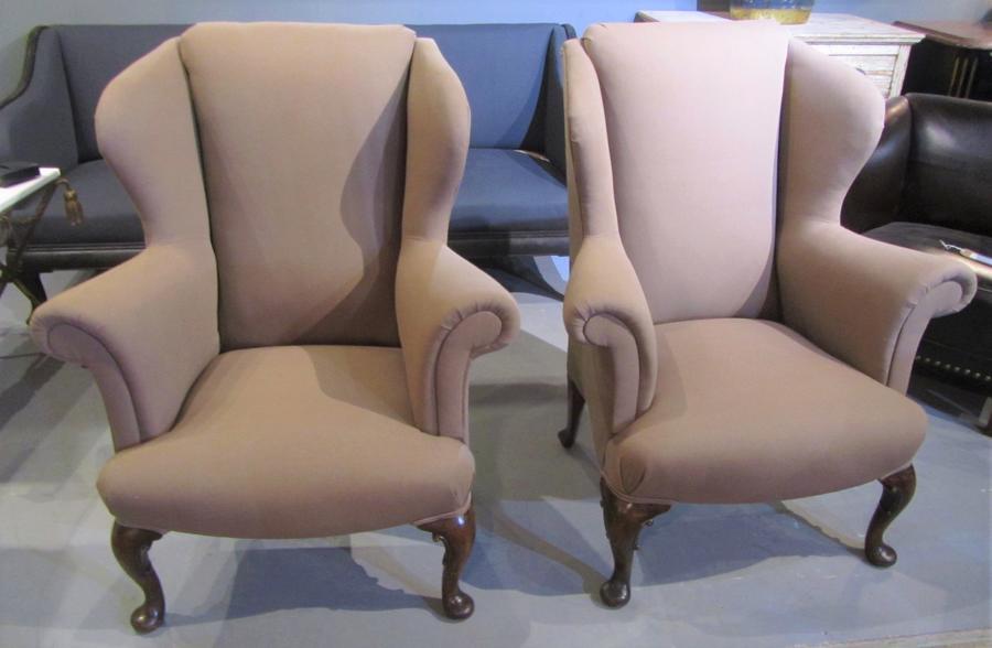 A pair of walnut wing chairs