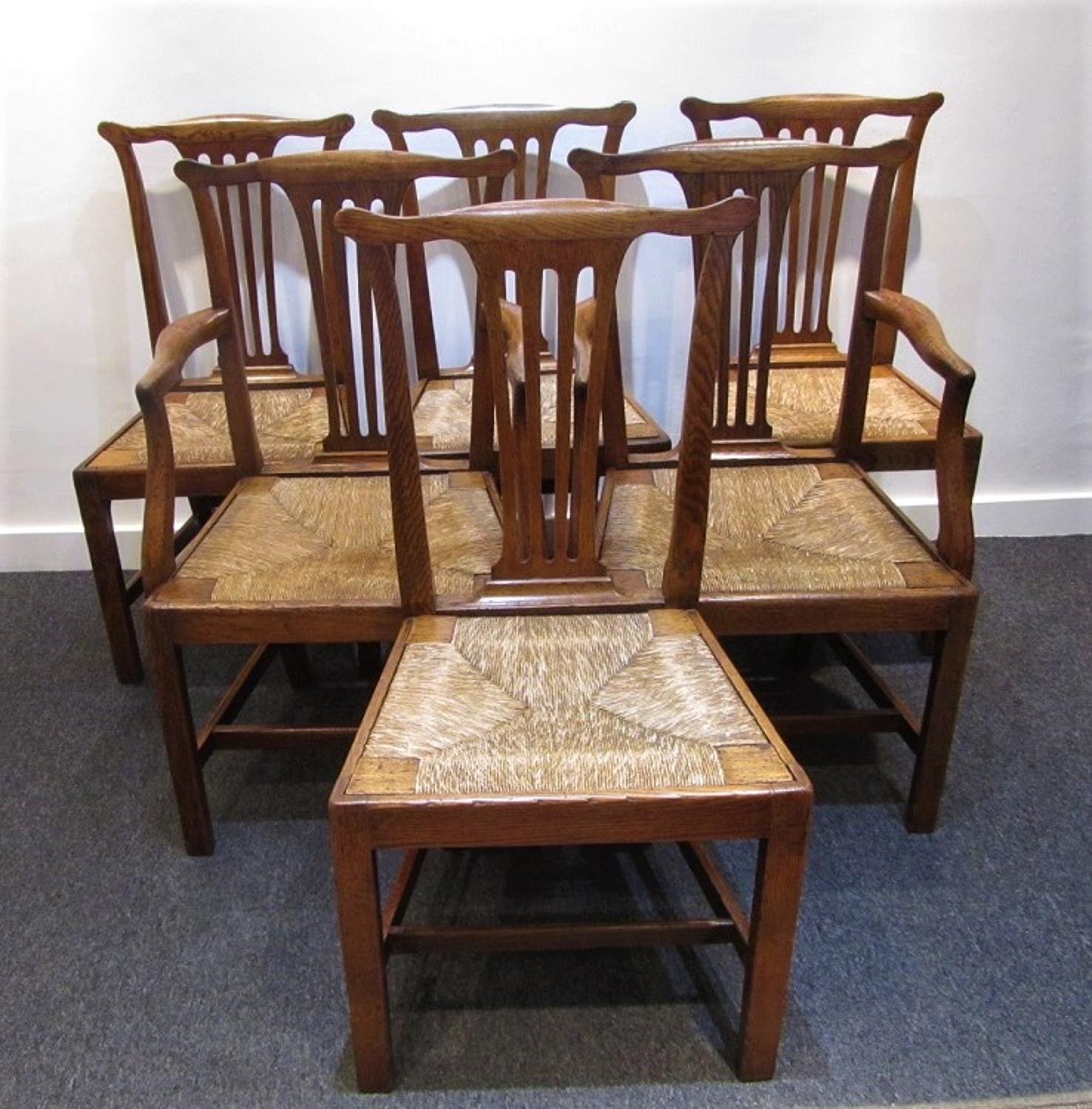 A set of six English provincial oak dining chairs