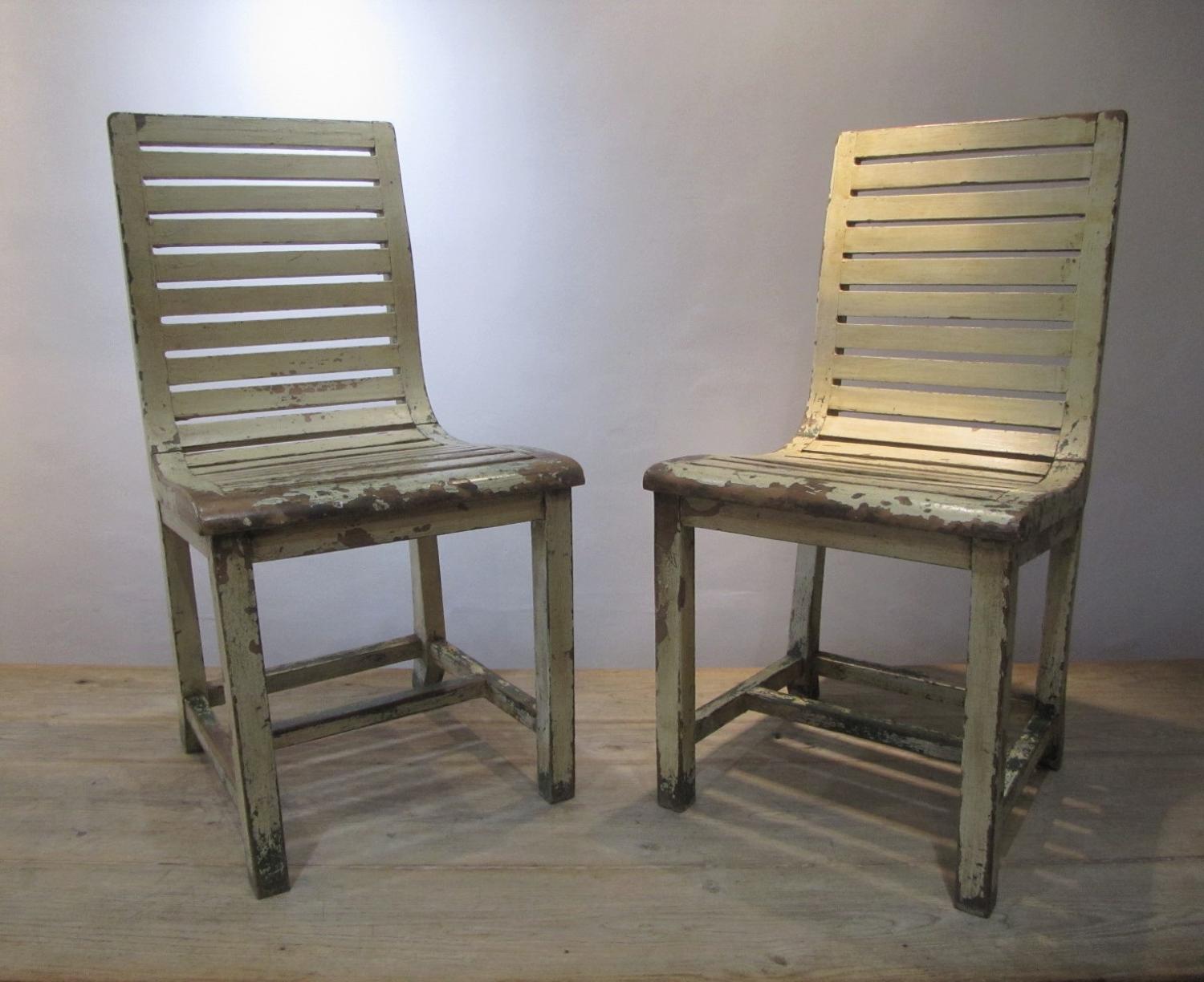 A pair of French slatted side chairs