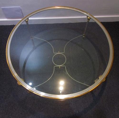 A circular Maison Jansen coffee table
