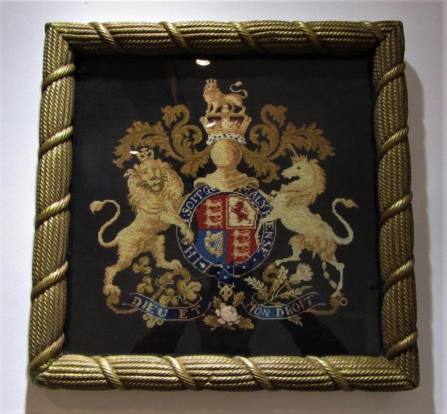 A needle point royal coat of arms