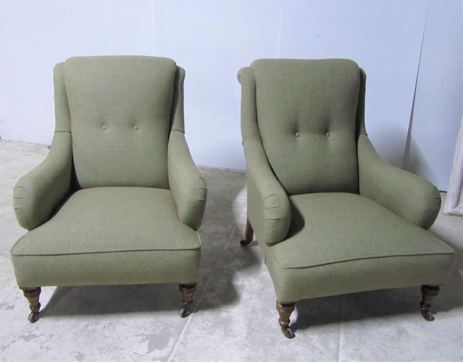 A pair of upholstered armchairs