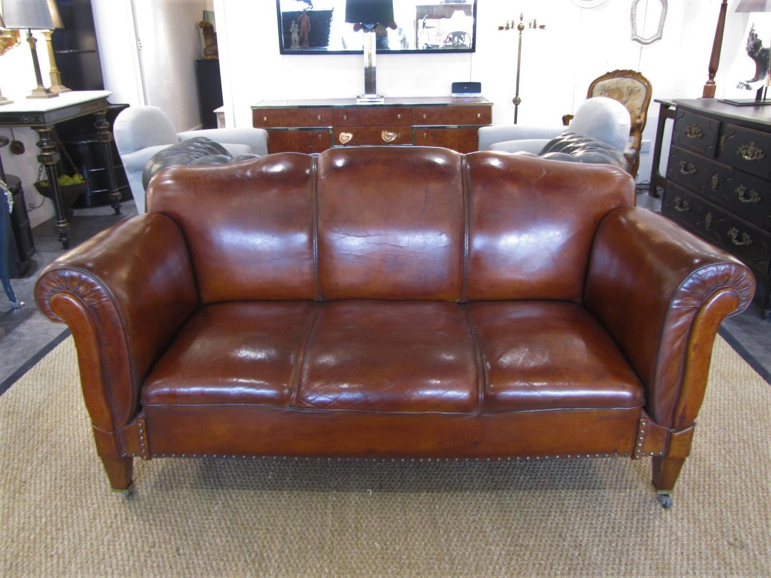 A leather double drop arm club sofa