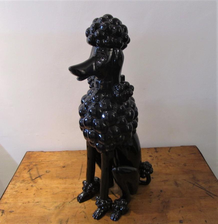A ceramic 70's seated Black Poodle