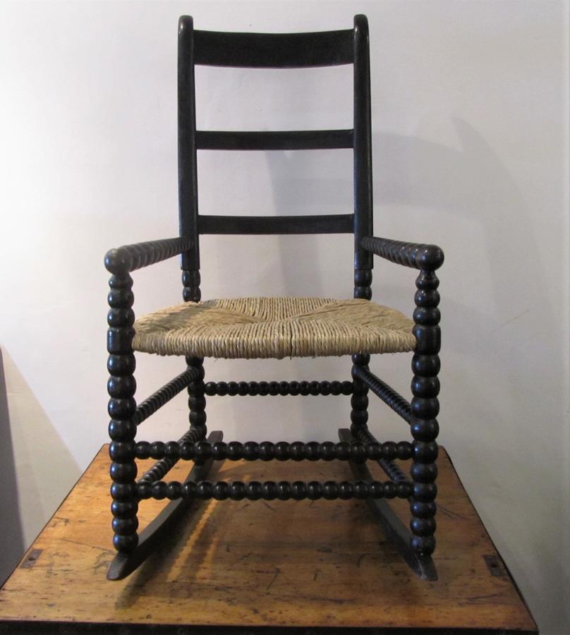 A bobbin turned folk art rocking chair