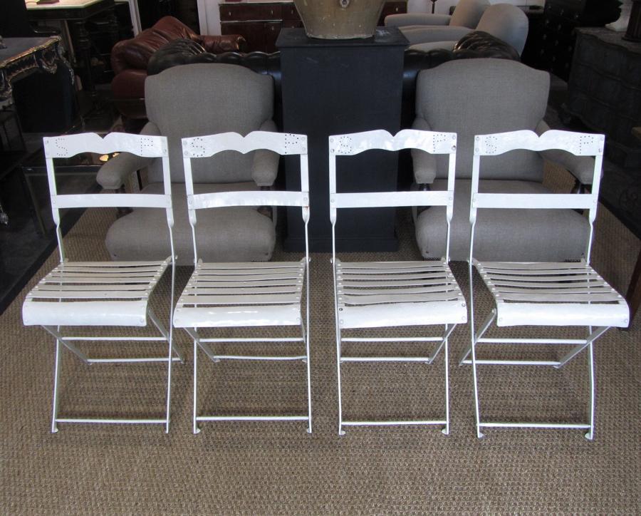 A set of four folding bandstand chairs