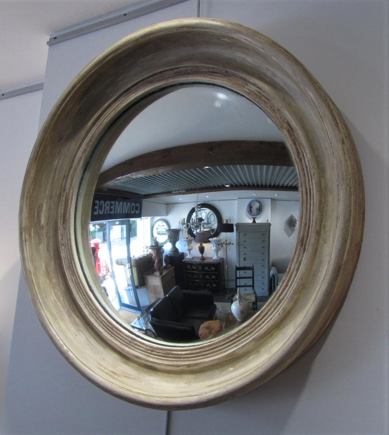 A late 19thC large convex mirror