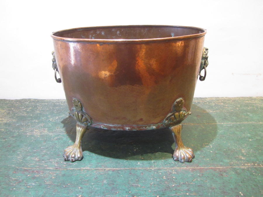 A copper and brass wine cooler / coal bucket