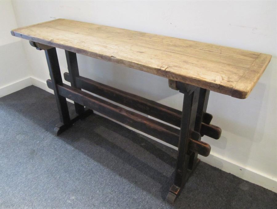 A trestle form console table