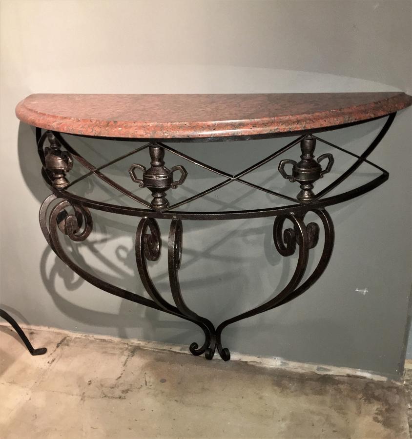A mid century iron and marble console