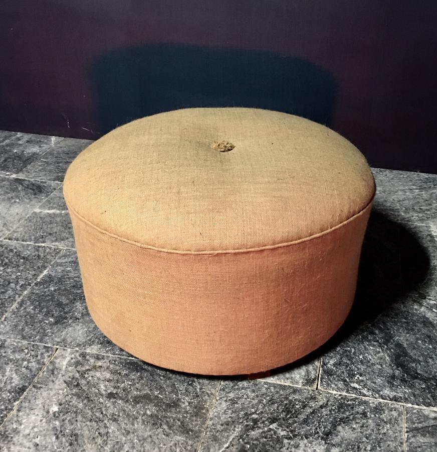 A circular stool pouffe