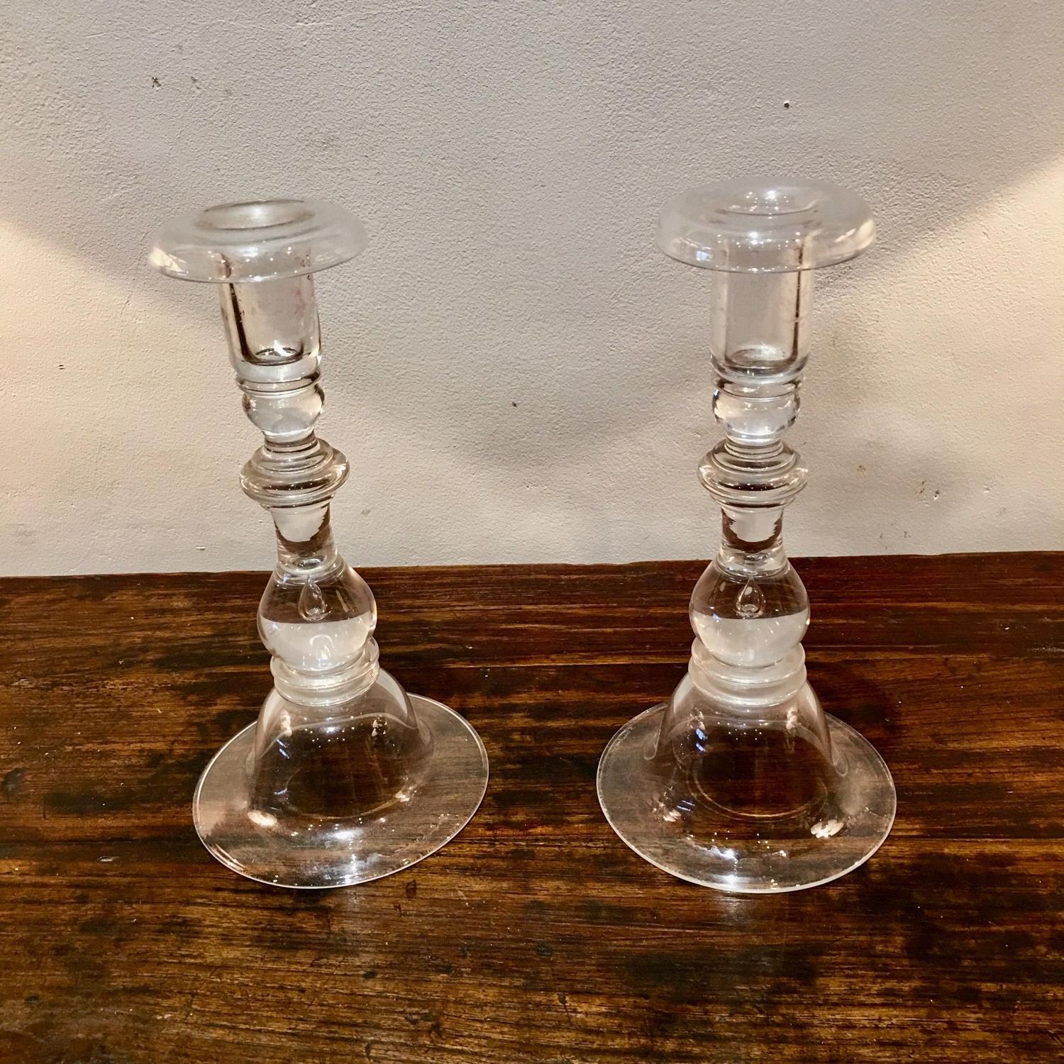 A pair of glass candle sticks