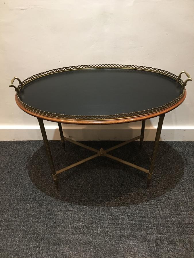 A brass fixed tray table