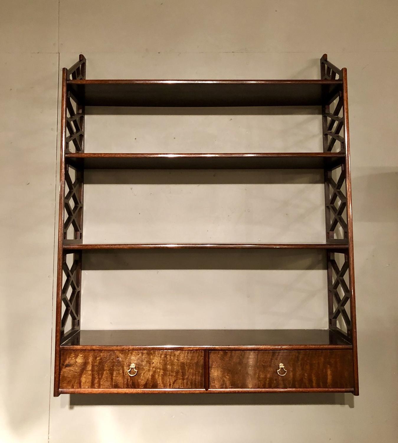 A pair of Chinese Chippendale hanging shelves