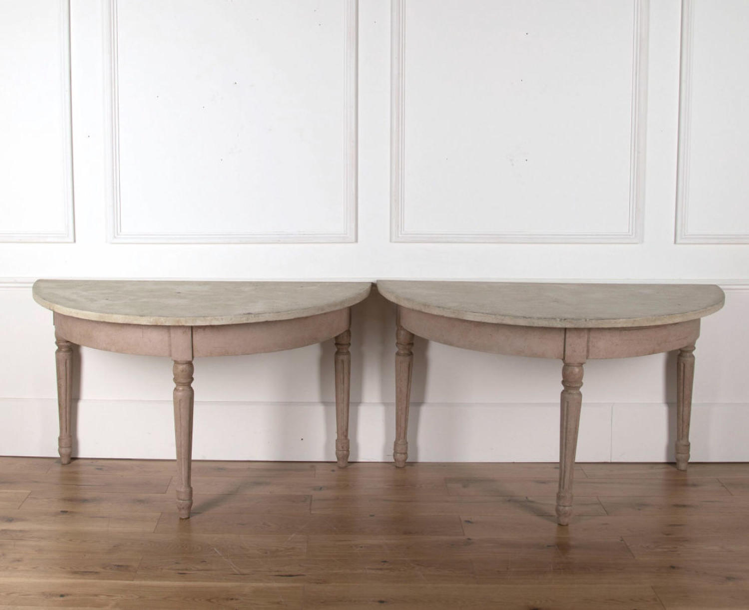 A pair of Painted Demi Lune Tables