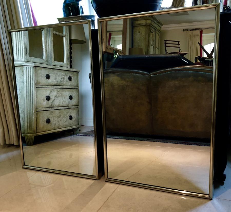 A pair of Bronze Framed shop mirrors