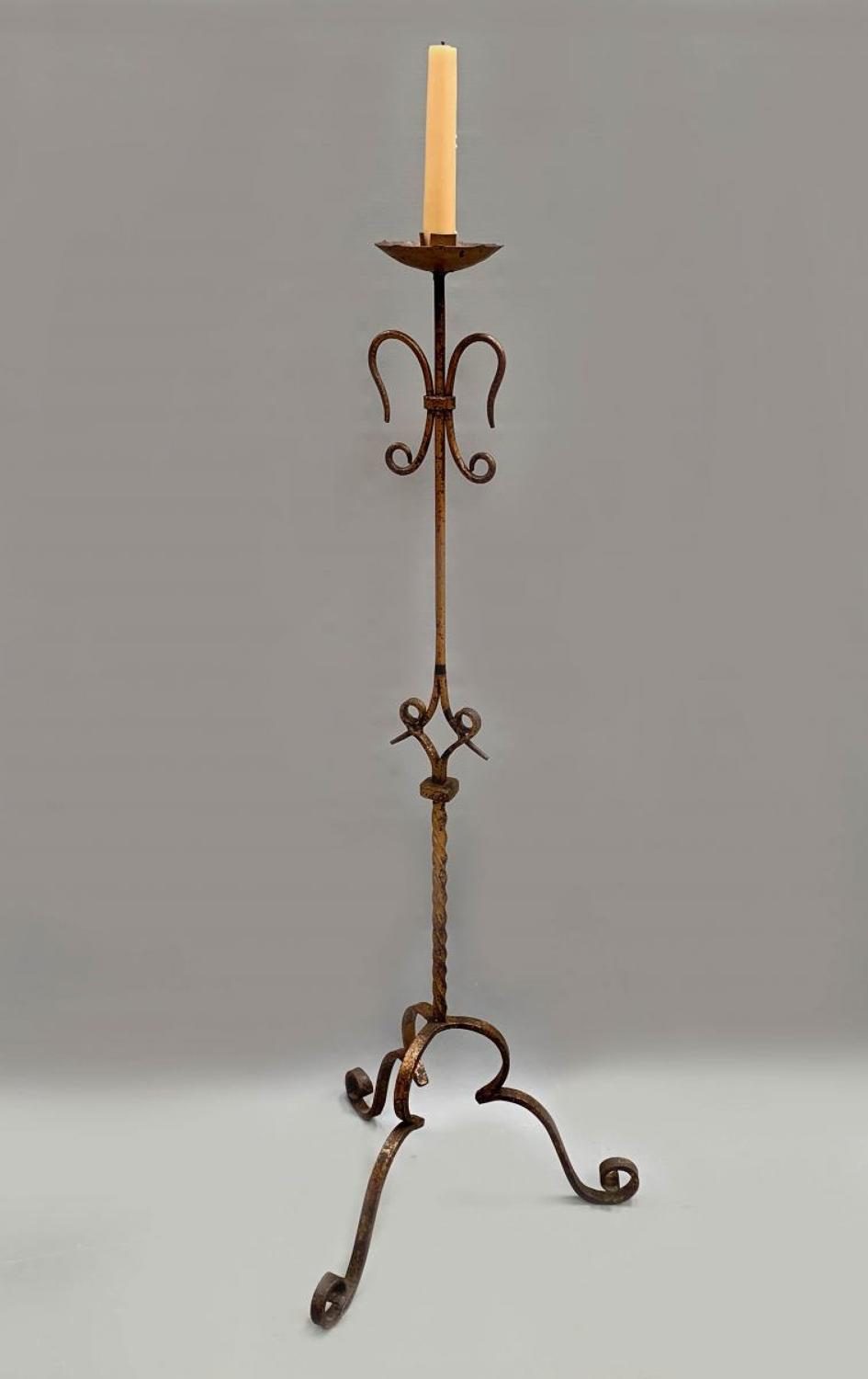 A Spanish gilt metal altar candle stand