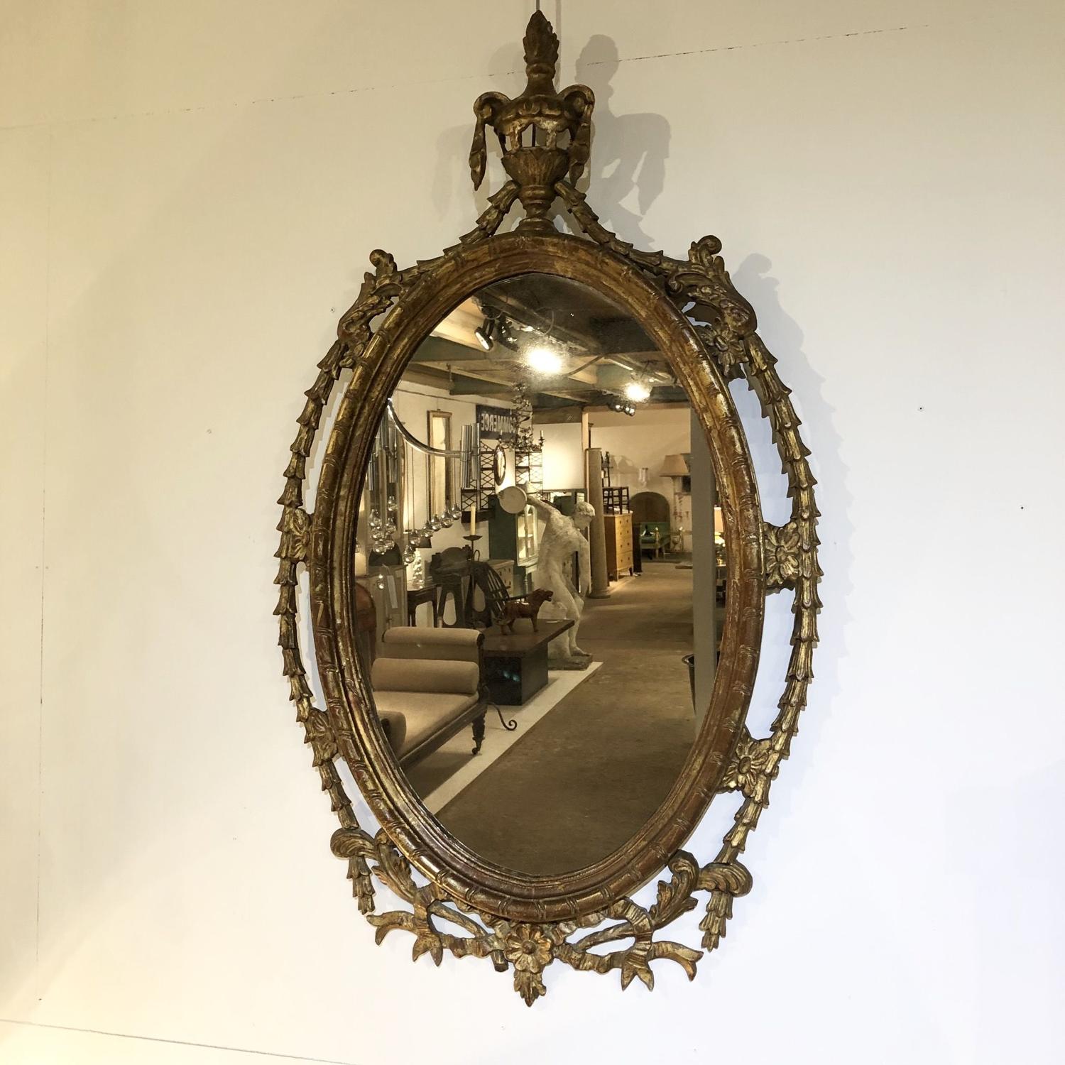 An Oval Giltwood mirror