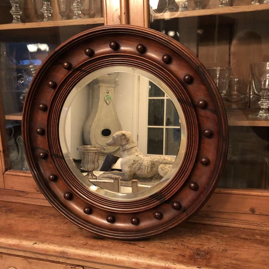 A circular Regency style mirror