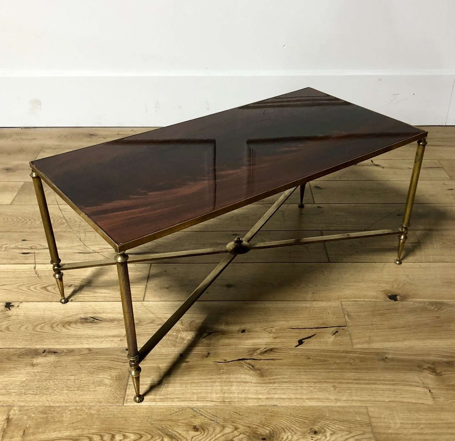 A brass a mahogany coffee table
