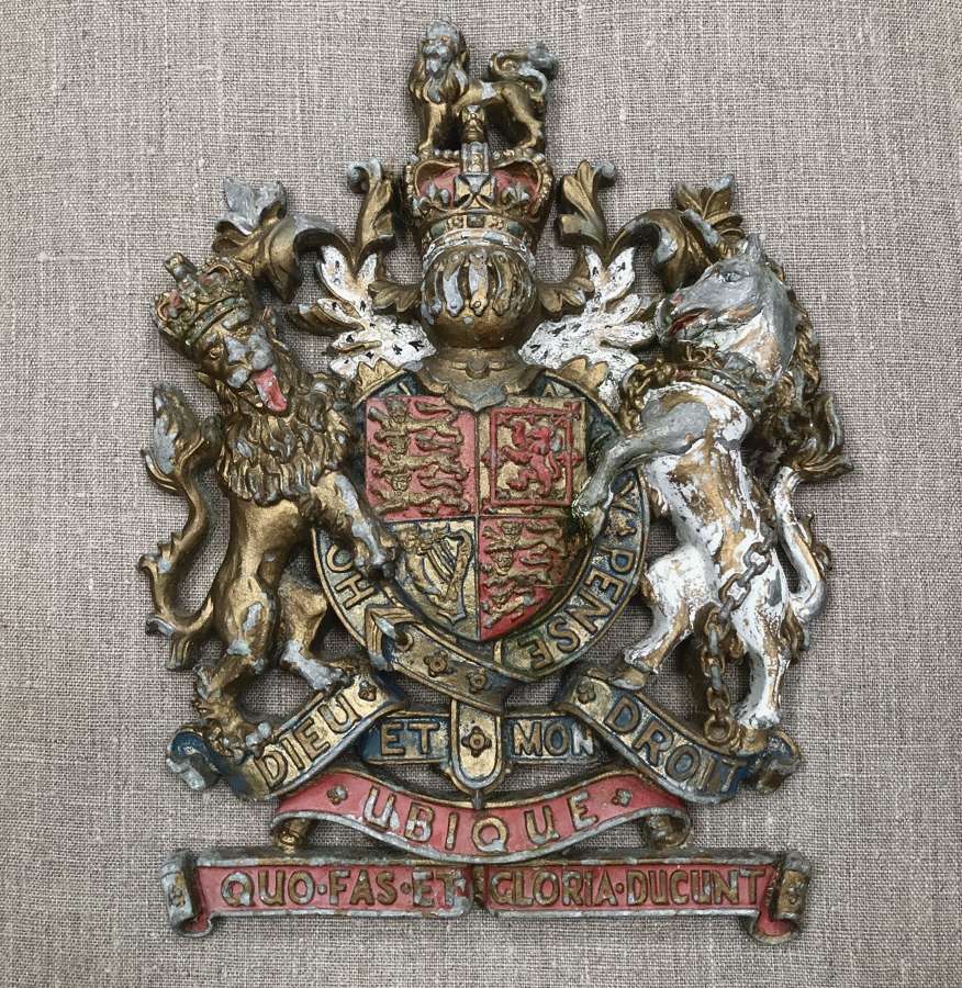 A cast metal coat of arms