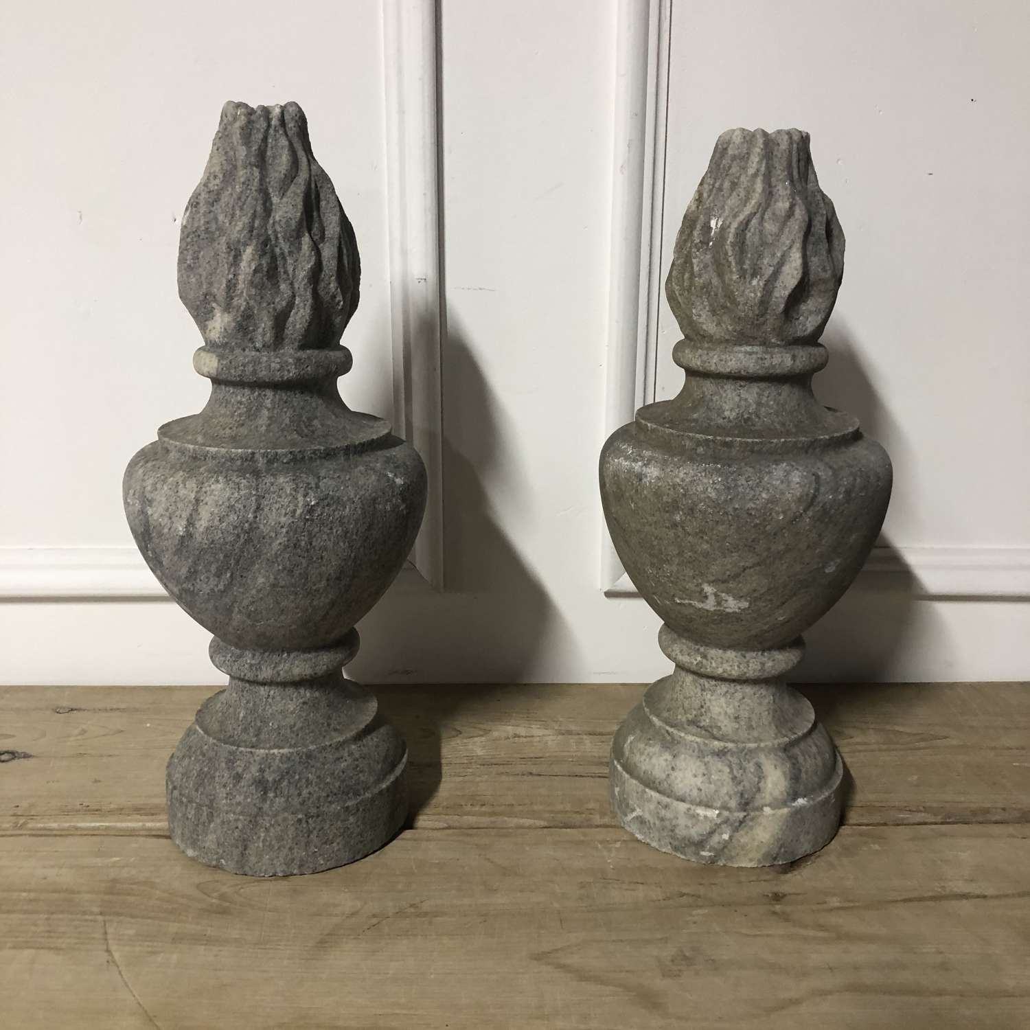A pair of granite flambe gate post finials