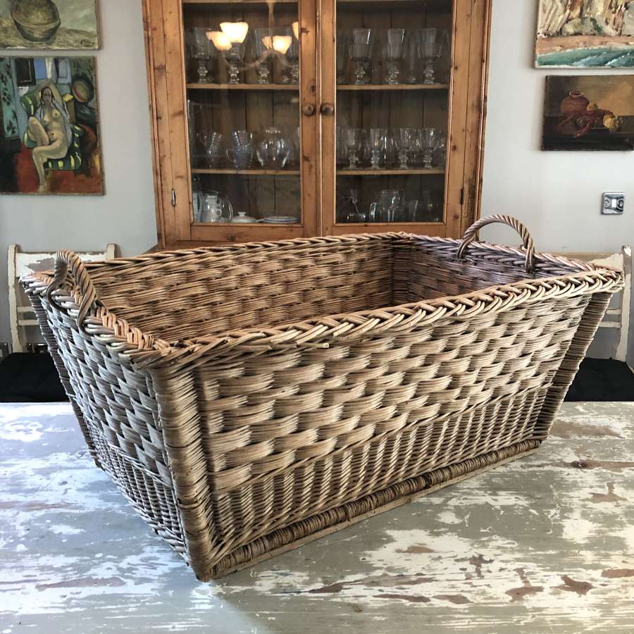 A decorative wicker log basket