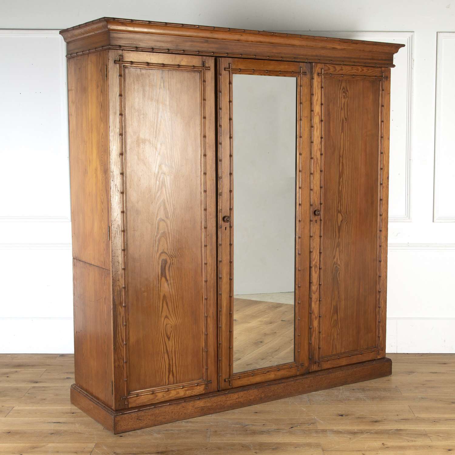 A Howard and Sons Faux Bamboo compactum wardrobe