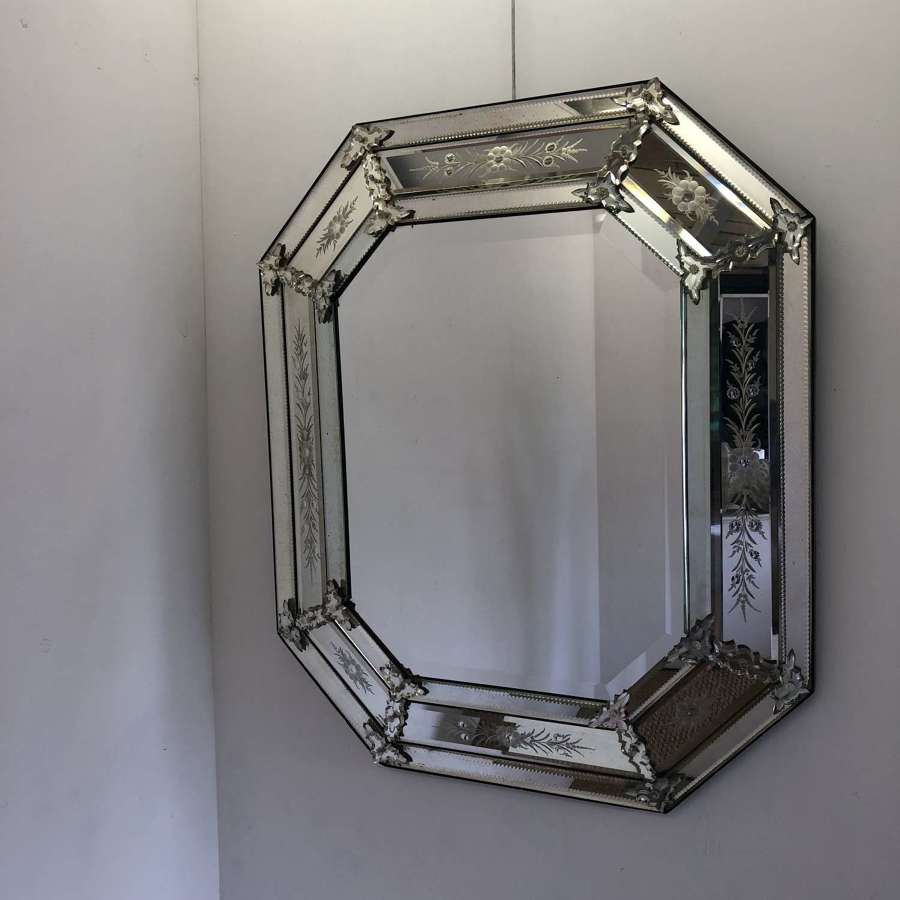 A large octagonal Venetian style mirror