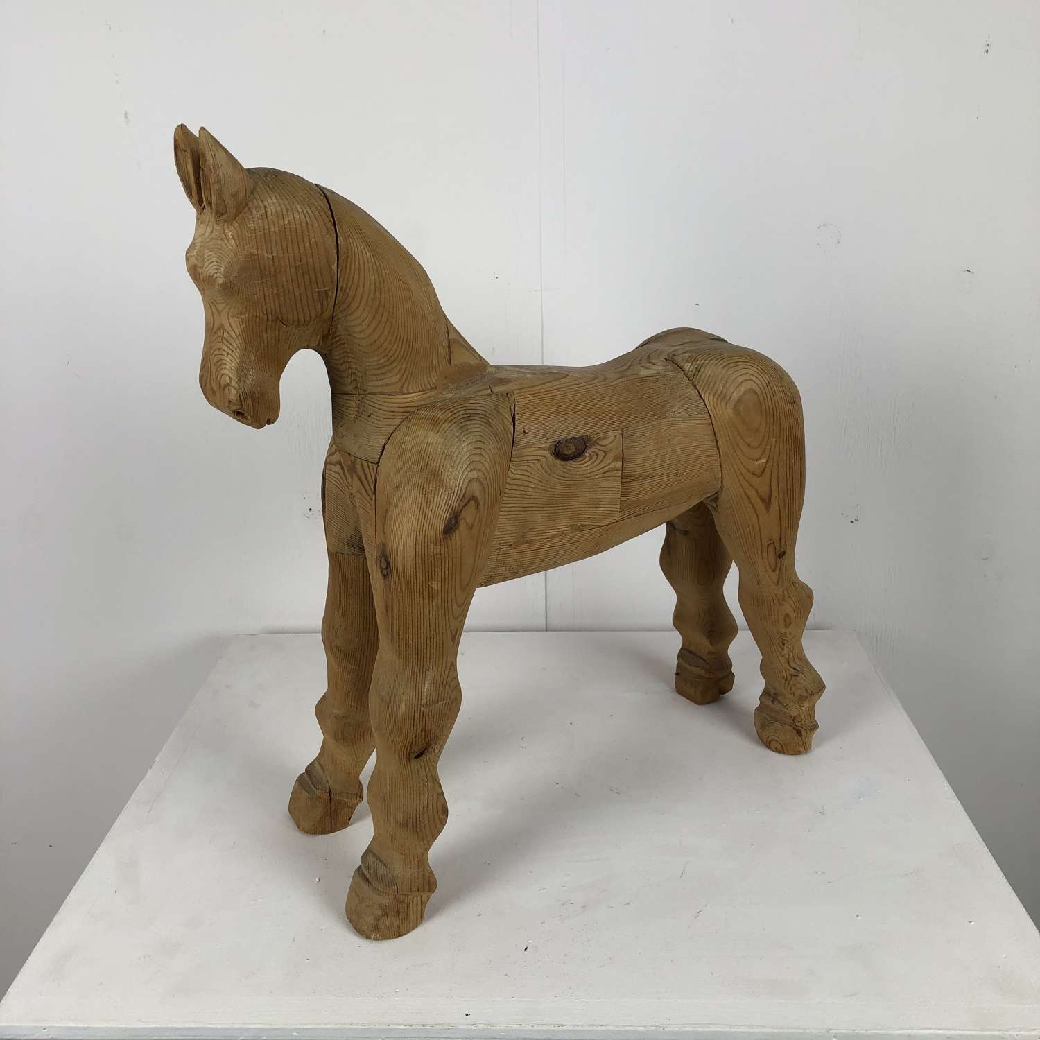 An English early 20thC carved wooden horse